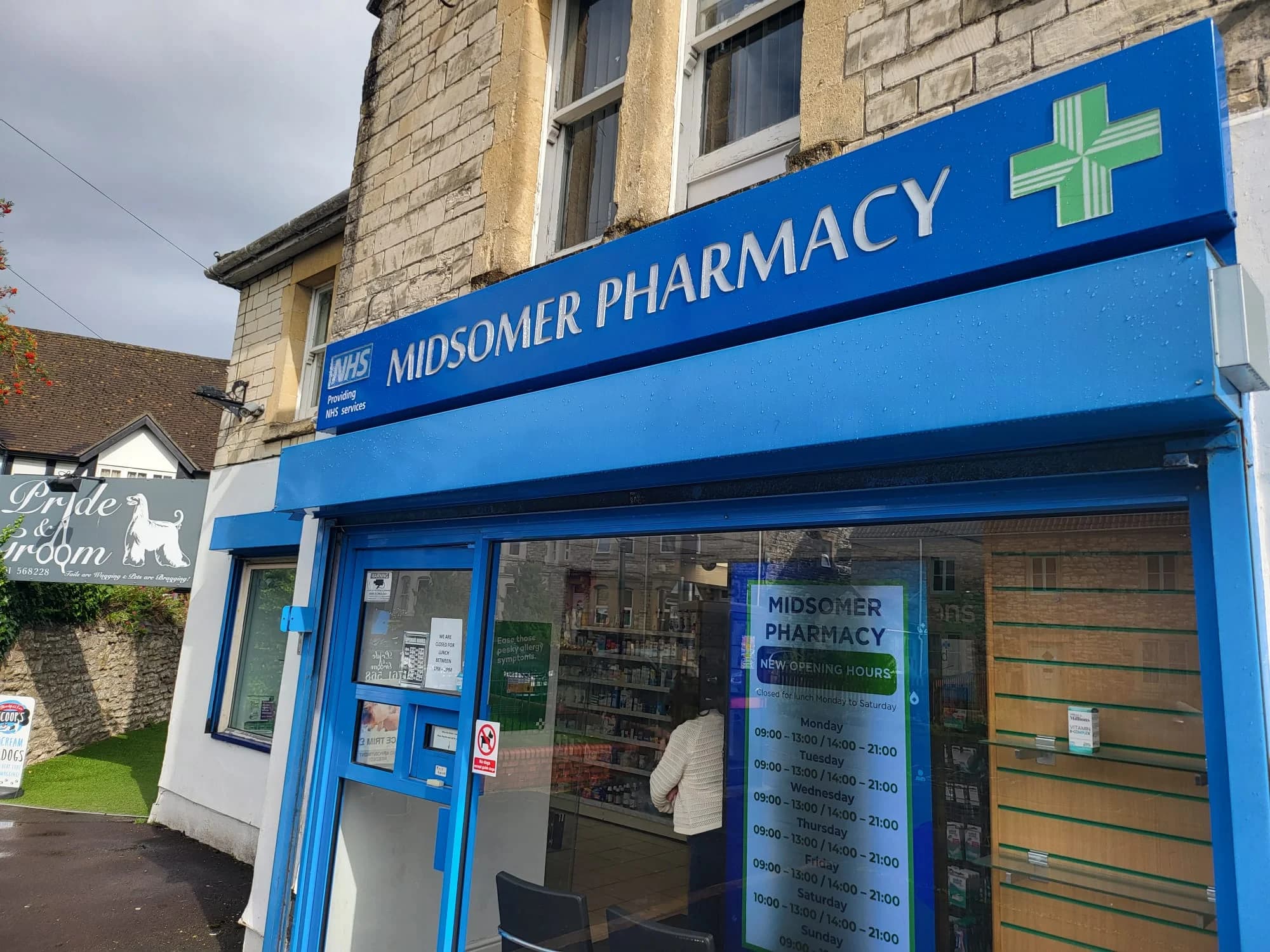 Pharmacist with a customer at Midsomer Pharmacy